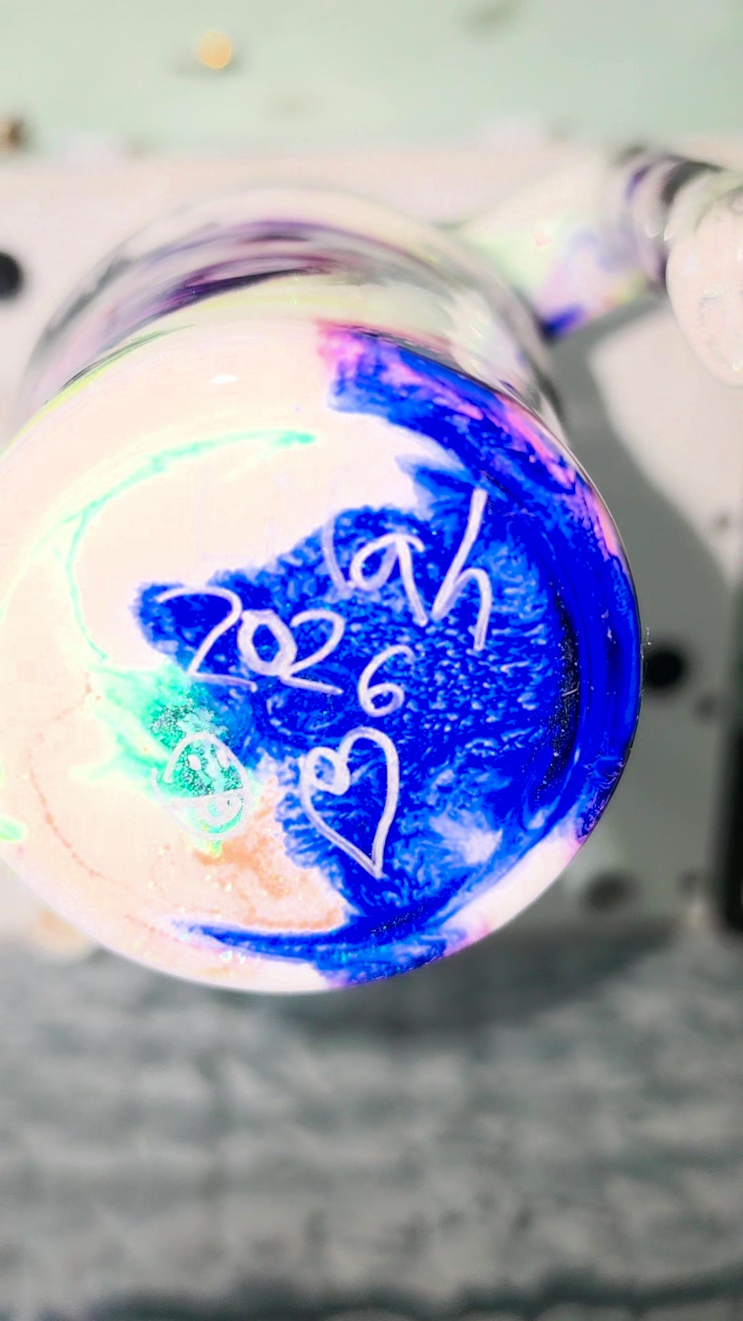 Bottom of the tumbler hand-signed by the artist with 2026 and a heart