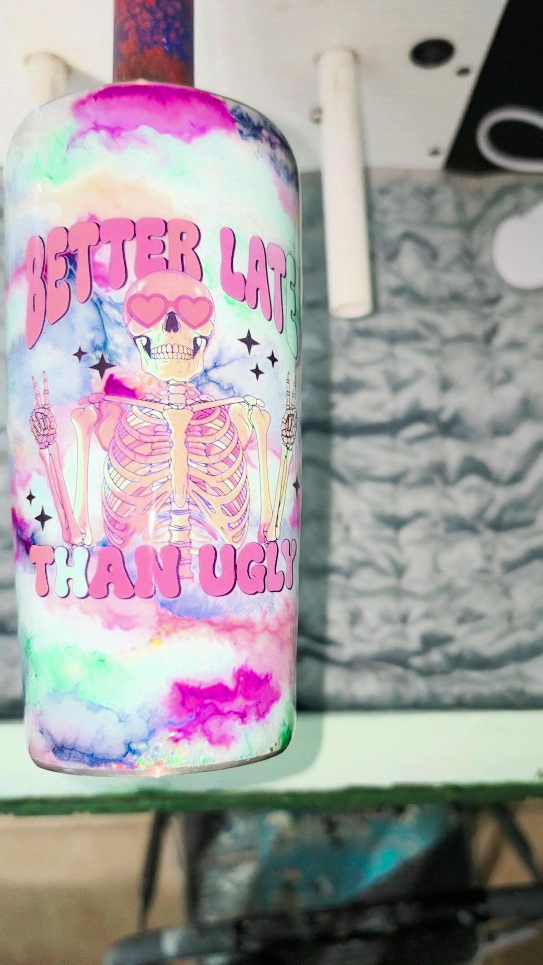 Skeleton in pink heart sunglasses throwing peace signs