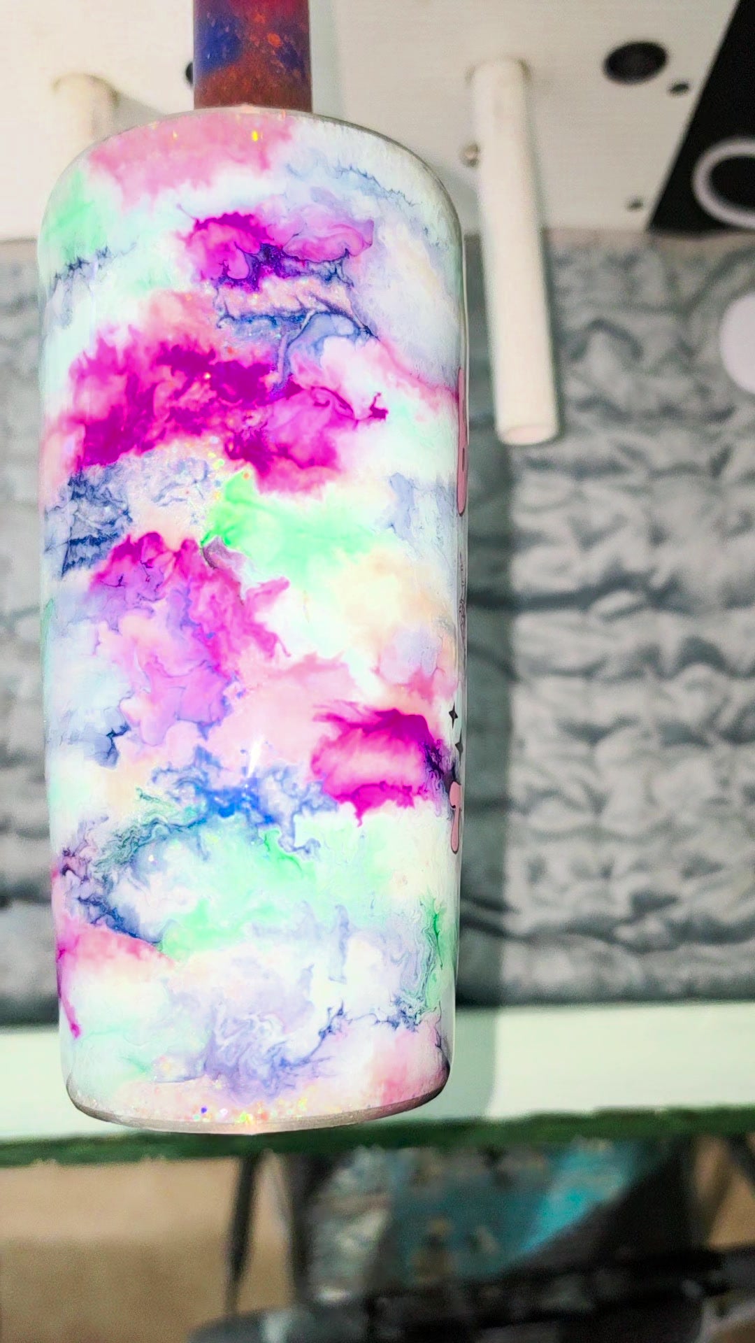 Back of the Strawbler showing pink, teal and navy ink smoke