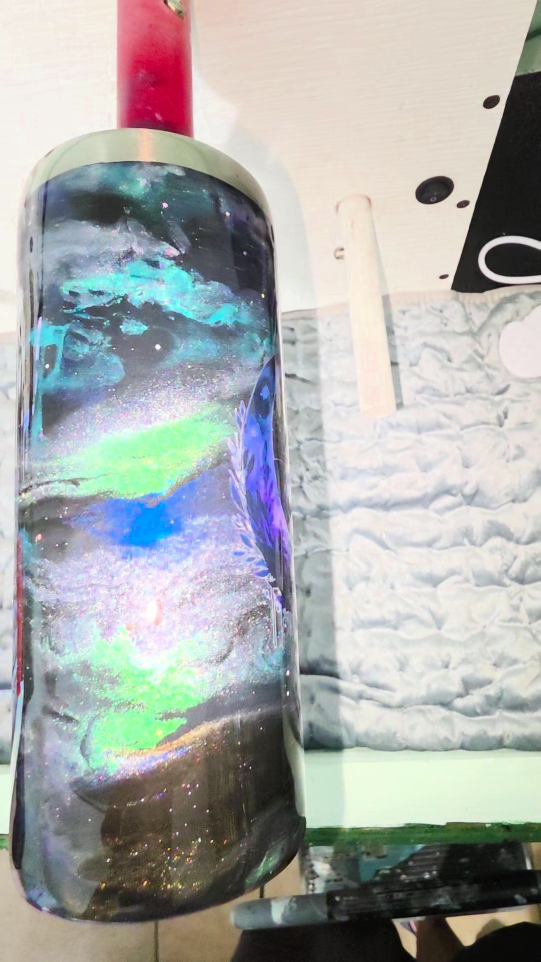 Side view showing the handle and ink swirls